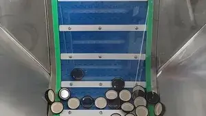 Elevador y alimentador de tapas automático