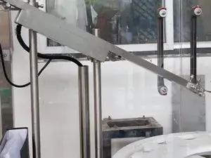 Unidad de colocación de tapas